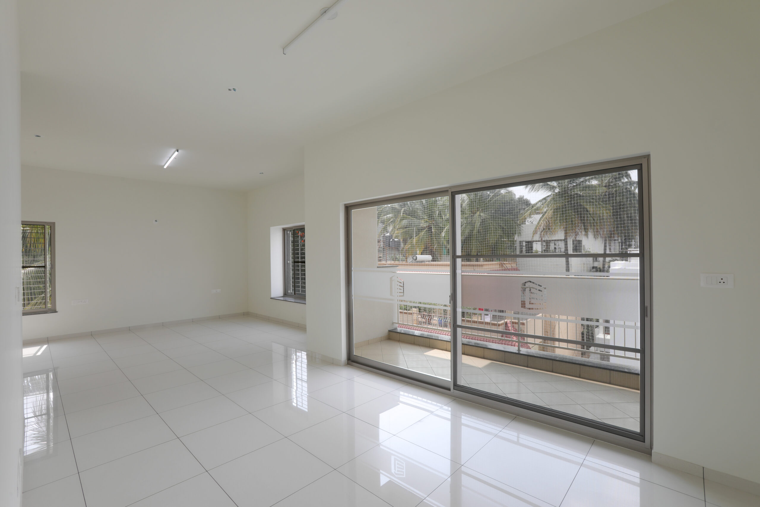 Spacious living room with balcony at BHADRA LANDMARK, Mahalakshmi Layout, Bengaluru